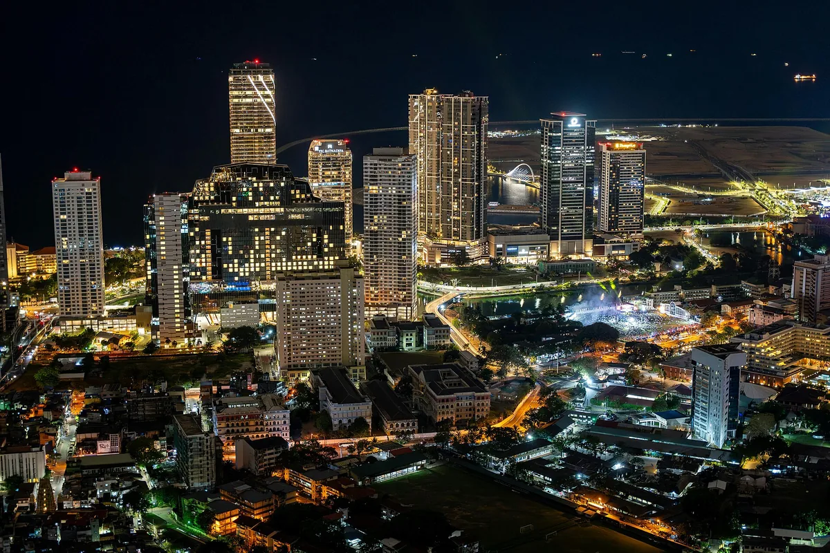 Colombo at night from the Lotus Tower, the lit business district against the sea.