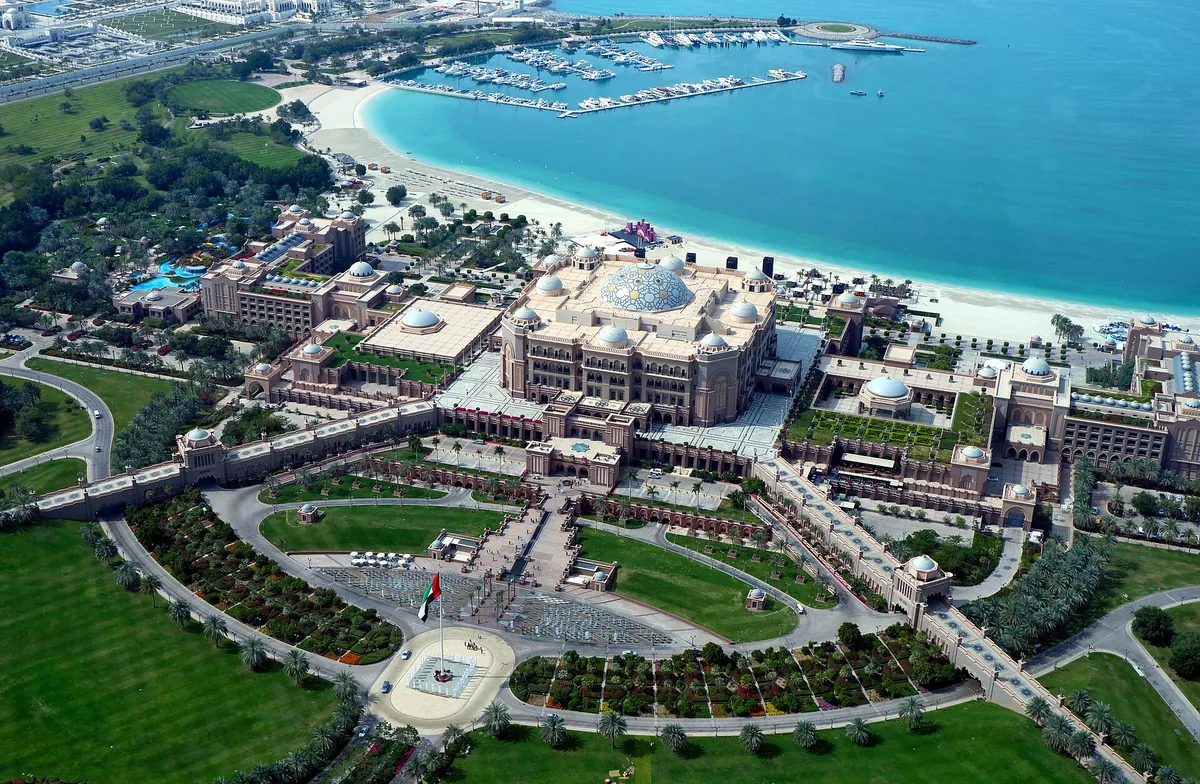 Emirates Palace from the air, its gardens and marina on the Abu Dhabi shore.