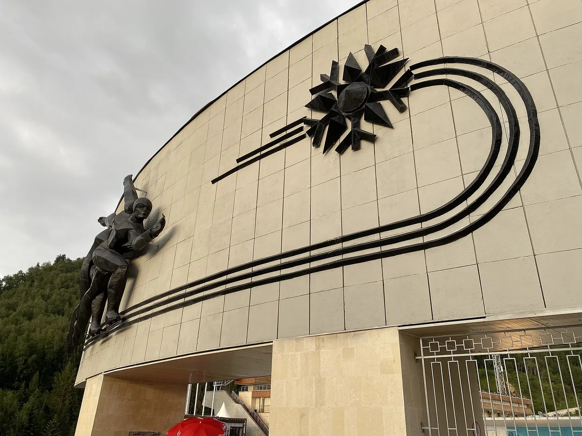 The curved concrete frontage of the Medeu skating rink in the gorge above Almaty.