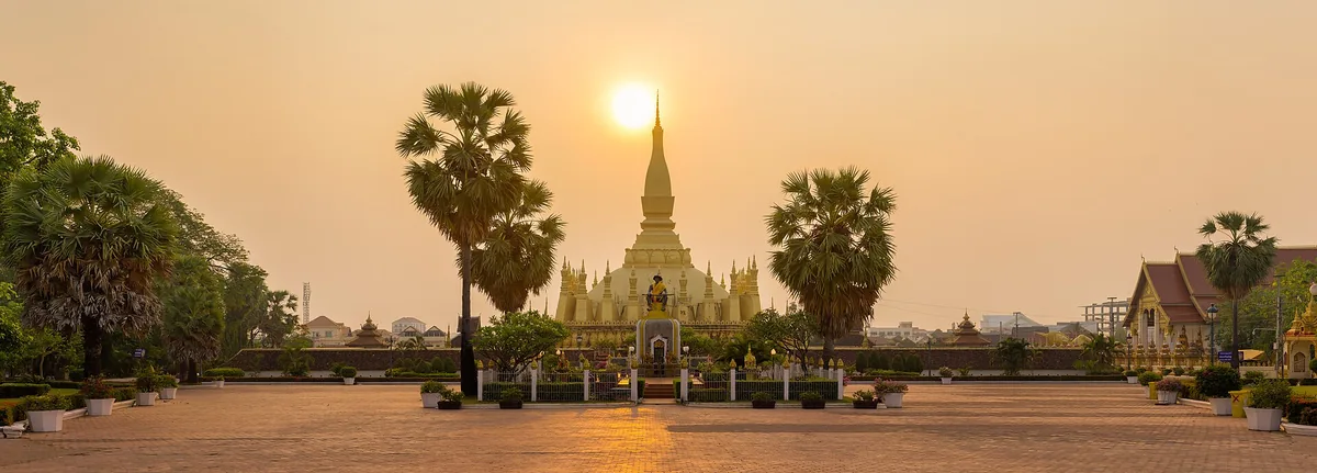 Pha That Luang, the golden stupa in Vientiane, at sunrise.