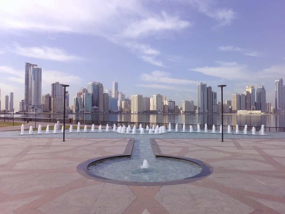 The Al Majaz waterfront on Khalid Lagoon, fountains in the foreground and the Sharjah skyline across the water.