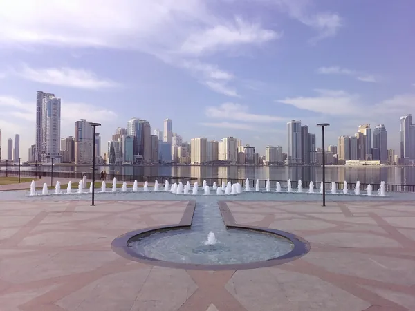 The Al Majaz waterfront on Khalid Lagoon, fountains in the foreground and the Sharjah skyline across the water.
