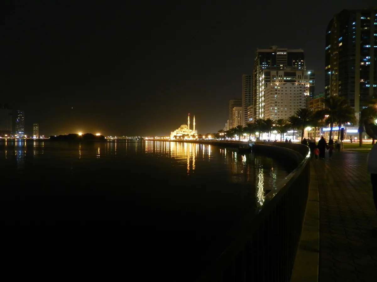 Al Noor Mosque on the Sharjah waterfront, its domes rising above the corniche.