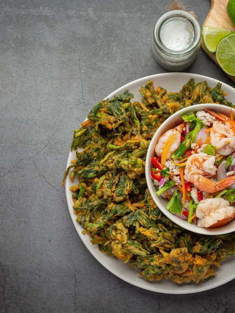 Thai dishes laid out on a table