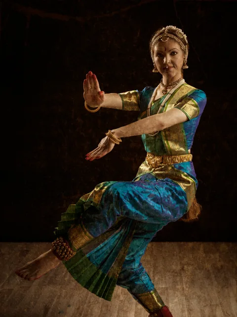 A Bharatanatyam dancer mid pose